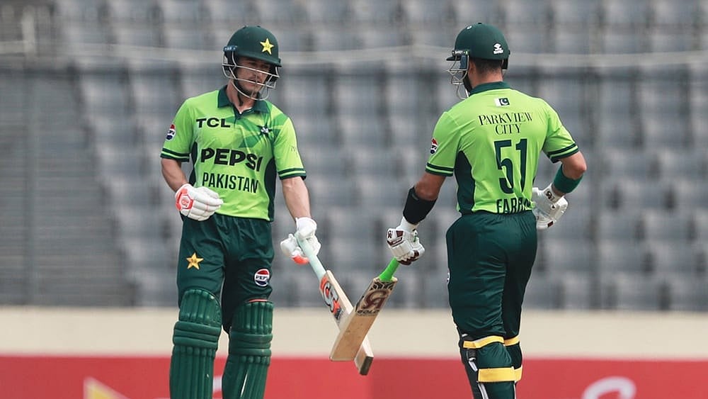 | Photo: AP/Mahmud Hossain Opu : Pakistan's Sahibzada Farhan and batting partner Maaz Sadaqat touch bats after hitting a boundary during the first one day international cricket match between Bangladesh and Pakistan in Mirpur, Bangladesh.