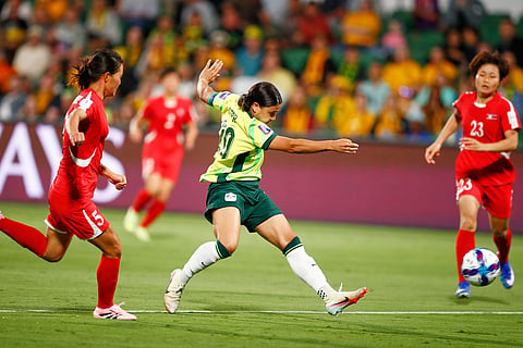 Australia's Sam Kerr scores her team's second goal during the Women's Asian Cup quarterfinal soccer match between Australia and North Korea in Perth, Australia.