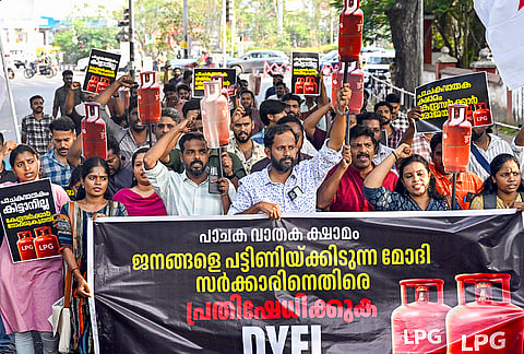 Activists of the Democratic Youth Federation of India take out a march to Lok Bhavan over LPG shortage and rising prices, in Thiruvananthapuram.