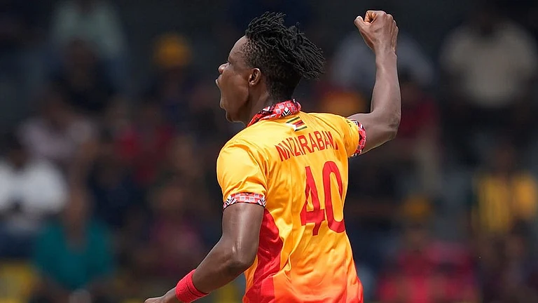 Zimbabwe's Blessing Muzarabani celebrates the wicket of Australia's Tim David during the T20 World Cup cricket match between Australia and Zimbabwe in Colombo, Sri Lanka. - | Photo: AP/Eranga Jayawardena