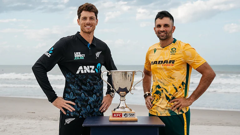 Captains Mitchell Santner (left) and Keshav Maharaj pose with the trophy ahead of the five-match New Zealand vs South Africa series. - X/ICC