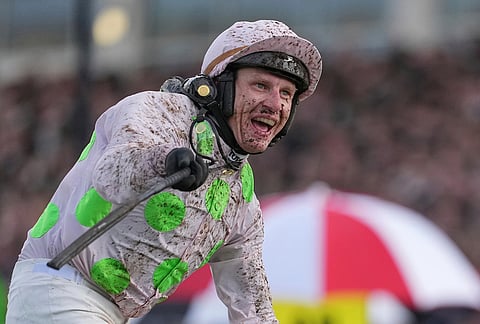 Paul Townend jockey of Gaelic Warrior the winner of the Gold Cup race, celebrates as he rides past the winning post on day four of the 2026 Cheltenham Festival in Cheltenham, England.