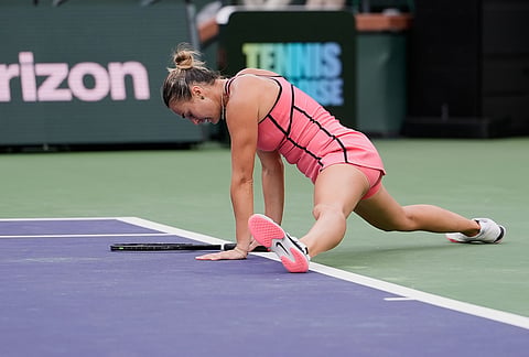 Aryna Sabalenka, of Belarus, reacts after losing a point against Linda Noskova, of the Czech Republic, during a semifinal match at the BNP Paribas Open tennis tournament, in Indian Wells, California. 