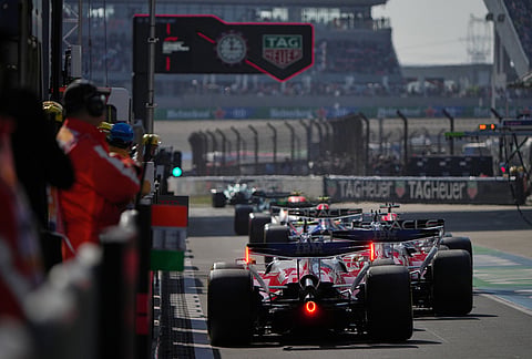 Cars line up during the qualifying session of the Chinese Formula One Grand Prix at the Shanghai International Circuit, in Shanghai, China.