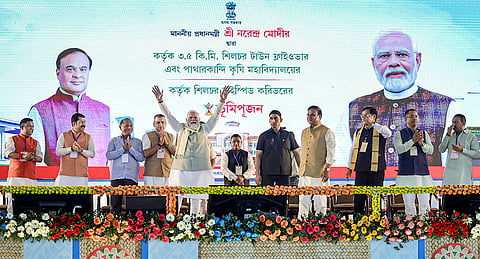 Prime Minister Narendra Modi, Union Minister of Ports, Shipping and Waterways Sarbananda Sonowal, Assam Chief Minister Himanta Biswa Sarma, and others, during the foundation stone laying and unveiling ceremony of various development works, in Silchar, Assam. 