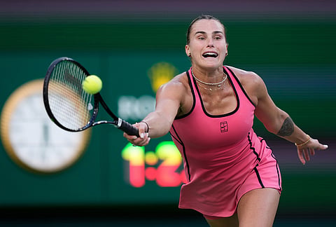 Aryna Sabalenka, of Belarus, returns a shot against Linda Noskova, of the Czech Republic, during a semifinal match at the BNP Paribas Open tennis tournament, in Indian Wells, California.