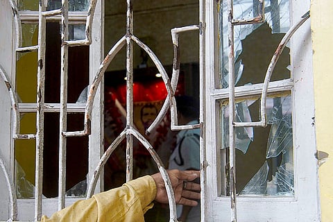 Kolkata: A damaged window at the residence of West Bengal Minister Shashi Panja, after clashes broke out between TMC and BJP supporters on Saturday, before the Prime Minister's rally, in Kolkata.