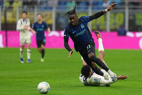 Atalanta's Ederson fouls Inter Milan's Yann Bisseck during the Serie A soccer match between Inter Milan and Atalanta in Milan, Italy.