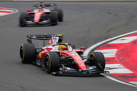 Ferrari driver Lewis Hamilton of Britain steers his car during the Chinese Formula One Grand Prix race at the Shanghai International Circuit, in Shanghai, China.