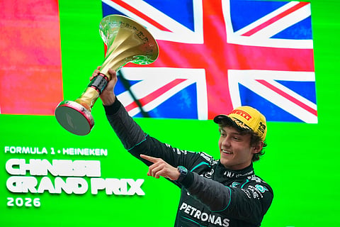 Race winner Mercedes driver Andrea Kimi Antonelli of Italy celebrates with the trophy on the podium after the Chinese Formula One Grand Prix at the Shanghai International Circuit in Shanghai, China.