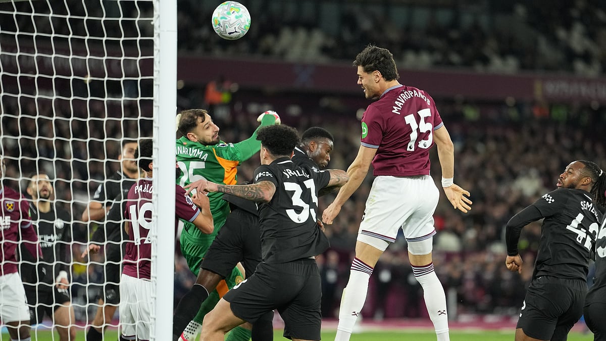 AP/Dave Shopland : Konstantinos Mavropanos (15) scores his side's first goal during the English Premier League soccer match between West Ham United and Manchester City in London.