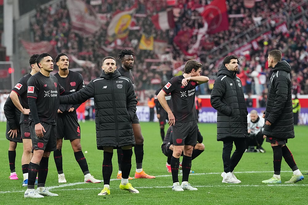 Leverkusen players react after the draw against Bayern Munich in a German Bundesliga soccer match, Leverkusen, Germany. - | Photo: AP/Martin Meissner