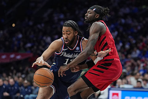Philadelphia 76ers' Trendon Watford, left, tries to get past Portland Trail Blazers' Jerami Grant during the second half of an NBA basketball game, in Philadelphia. 