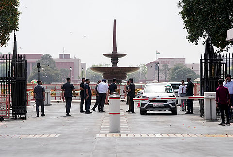 Security officials at the site where a vehicle was stopped after a boom barrier fell at an entry gate of the Parliament due to a technical glitch, apparently caused by strong winds, in New Delhi. The incident activated the security alarm and a quick reaction team (QRT). 
