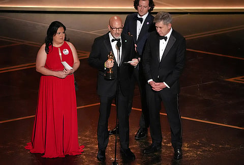 Gloria Cazares, from left, Joshua Seftel, Conall Jones, and Steve Hartman accept the award for documentary short film for "All the Empty Rooms" during the Oscars at the Dolby Theatre in Los Angeles.