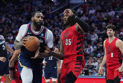Philadelphia 76ers' Andre Drummond, center left, goes up to shoot against Portland Trail Blazers' Robert Williams III during the second half of an NBA basketball game in Philadelphia.