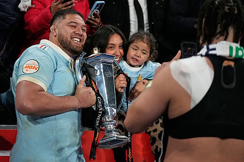 Emmanuel Meafou of France celebrates with fans after winning the Six Nations rugby union match between France and England in Saint-Denis, outside Paris, Saturday, March 14, 2026. ()