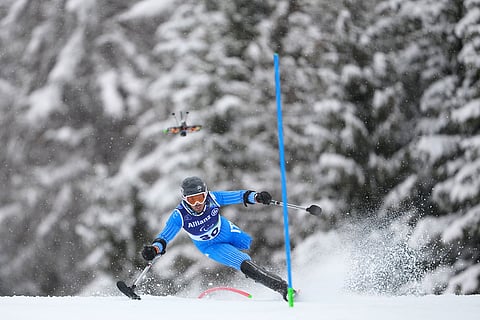 Davide Bendotti, of Italy, competes in his first run of the alpine skiing men's slalom standing at the 2026 Winter Paralympics, in Cortina d'Ampezzo, Italy.