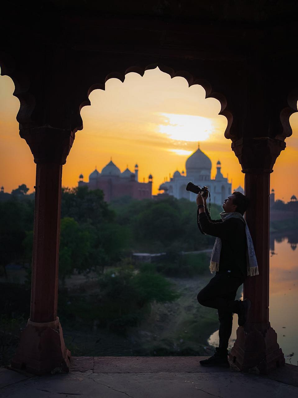 Photographer capturing sunset view