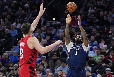 Philadelphia 76ers' Andre Drummond (1) goes up to shoot against Portland Trail Blazers' Donovan Clingan during the second half of an NBA basketball game, in Philadelphia.