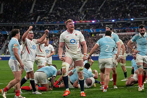 England's Ollie Chessum celebrates after scoring a try during the Six Nations rugby union match between France and England in Saint-Denis, outside Paris.