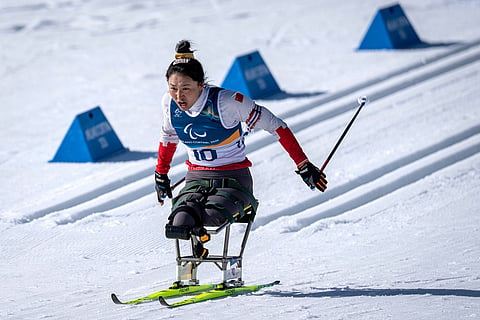 China's Shiyu Wang competes in the Para Biathlon Women's sprint sitting at the 2026 Winter Paralympics, in Tesero, Italy.