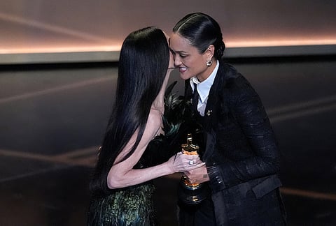 Demi Moore presents the award for best cinematography to Autumn Durald Arkapaw during the Oscars at the Dolby Theatre in Los Angeles. 