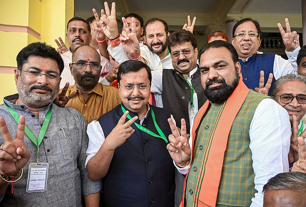 Bihar Deputy Chief Minister Samrat Choudhary, right front, with BJP National President and NDA candidate Nitin Nabin, centre front, during voting in the Rajya Sabha polls, at Vidhan Sabha in Patna. - | Photo: PTI