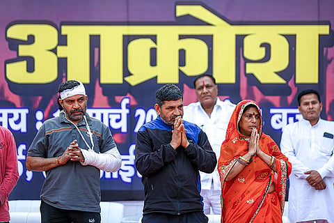 Sunita, right front, mother of 26-year-old Tarun, with other family members, during a protest by members of several right-wing Hindu organisations over Tarun's killing, in New Delhi's Uttam Nagar.