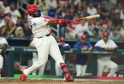 Dominican Republic Vladimir Guerrero Jr. (27) hits a double during the fourth inning of a World Baseball Classic semifinal game against the United States in Miami.