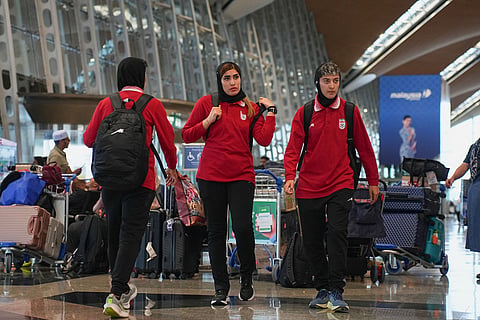 Members of Iran's women's football team arrive at the Kuala Lumpur International Airport in Sepang, Malaysia.