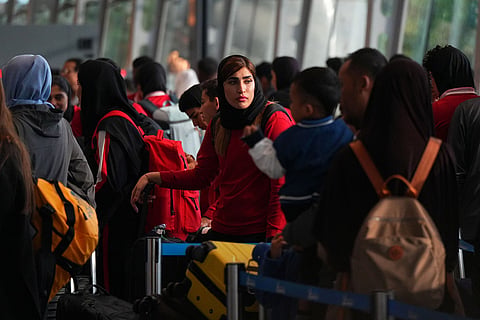 Members of Iran's women's football team arrive at the Kuala Lumpur International Airport in Sepang, Malaysia.