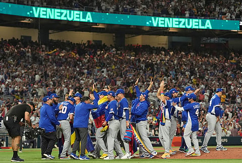 The Venezuela team celebrates after defeating Italy at a World Baseball Classic semifinal game, in Miami. 