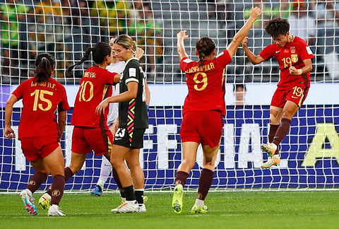 China's Zhang Linyan, right, celebrates after scoring her team's fourth goal from a penalty during the Women's Asian Cup semifinal soccer match between China and Australia in Perth, Australia.