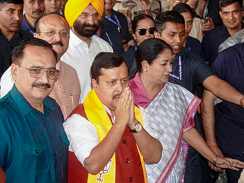 Delhi Chief Minister Rekha Gupta with BJP National President Nitin Nabin, upon his arrival at Indira Gandhi International Airport, in New Delhi. Delhi Education Minister Ashish Sood and state party President Virender Sachdeva are also seen. 