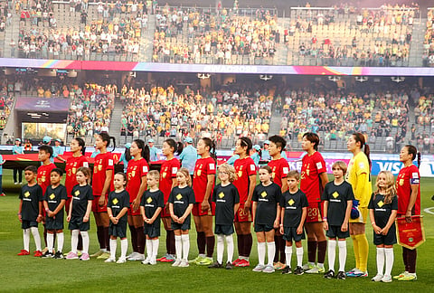China line up for their national anthem ahead of the Women's Asian Cup semifinal soccer match between China and Australia in Perth, Australia.