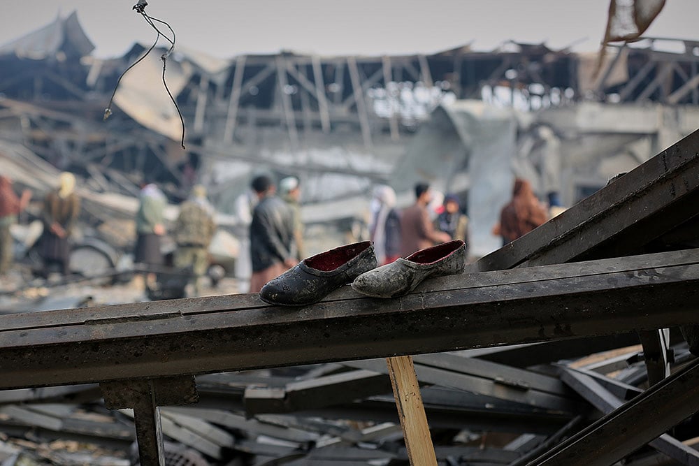 | Photo: AP/Siddiqullah Alizai : Residents and rescue workers inspect the site of a late-Monday airstrike at a drug rehabilitation hospital in Kabul, Afghanistan.