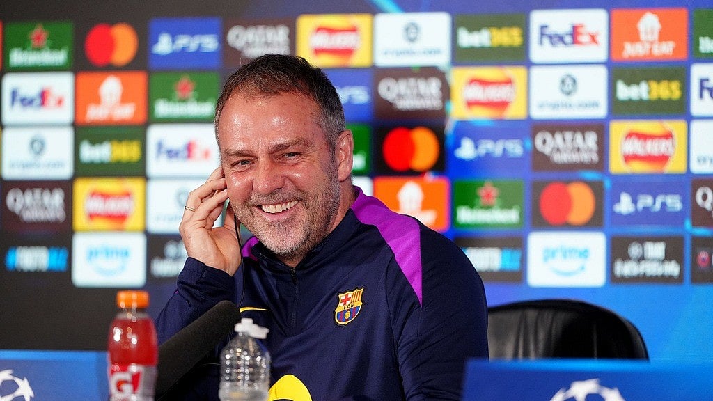 Barcelona manager Hansi Flick smiles during a press conference at St. James' Park, Newcastle upon Tyne, England, Monday March 9, 2026, ahead of the Champions League soccer match between Newcastle United and Barcelona on Tuesday.  - AP Photo