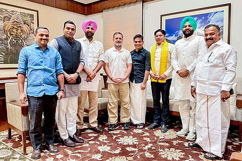 In this image posted on March 18, 2026, LoP in the Lok Sabha Rahul Gandhi, centre, meets Congress MPs Dean Kuriakose, C Kiran Kumar Reddy, Amarinder Singh Raja Warring, Hibi Eden, Prashant Padole, Gurjeet Singh Aujla, and Manickam Tagore, whose suspension was revoked by the Lok Sabha on Tuesday, in New Delhi.