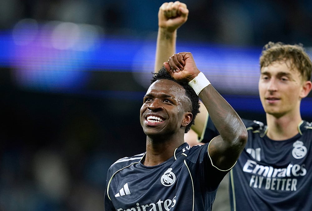 | Photo: AP/Dave Thompson : Real Madrid's Vinicius Junior celebrates after the Champions League round of 16 second leg soccer match between Manchester City and Real Madrid in Manchester.