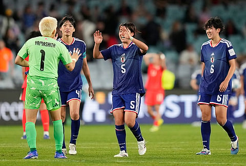 Japan players celebrate following the Women's Asian Cup semifinal soccer match between Japan and South Korea in Sydney.