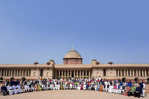 In this image posted on March 18, 2026, Vice President CP Radhakrishnan, Prime Minister Narendra Modi, Lok Sabha Speaker Om Birla, Union Ministers Kiren Rijiju, Nirmala Sitharaman, and others, pose for a group photograph with retiring and recently retired Members of Rajya Sabha, in New Delhi.
