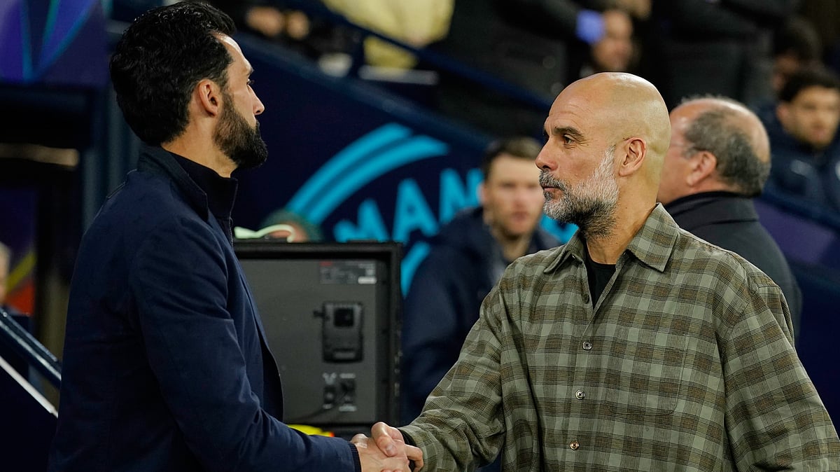 Real Madrid's head coach Alvaro Arbeloa shakes hands with Manchester City's head coach Pep Guardiola ahead of the Champions League round of 16 second leg soccer match between Manchester City and Real Madrid in Manchester, Tuesday, March 17, 2026. - | Photo: AP/Dave Thompson