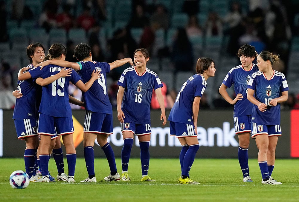 | Photo: AP/Rick Rycroft : Japan players celebrate following the Women's Asian Cup semifinal soccer match between Japan and South Korea in Sydney.