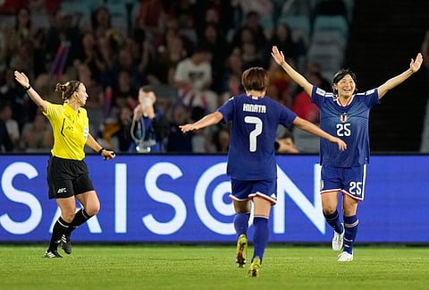 Japan's Remina Chiba, right, celebrates after scoring her team's fourth goal during the Women's Asian Cup semifinal soccer match between Japan and South Korea in Sydney.