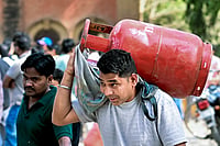 | Photo: PTI : A man carries a refilled LPG cooking gas cylinder, amid a shortage linked to the ongoing West Asia conflict affecting the global energy supply chain, in Prayagraj.
