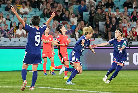 Japan's Maika Hamano reacts, centre, after scoring her team's second goal during the Women's Asian Cup semifinal soccer match between Japan and South Korea in Sydney.