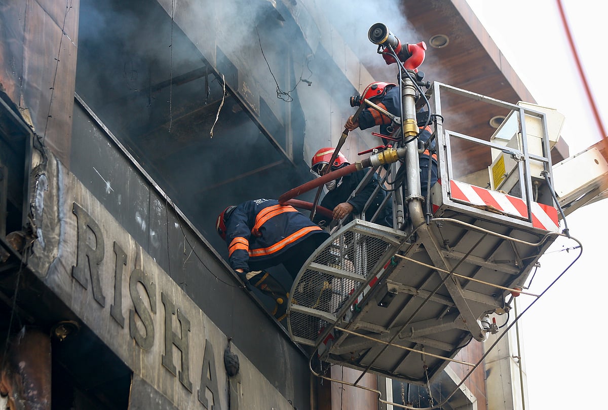 -Source: PTI : New Delhi: Rescue operations underway after a fire broke out in a residential building near Palam Metro station, in New Delhi, Wednesday, March 18, 2026. Seven people, including three children, were killed. 
