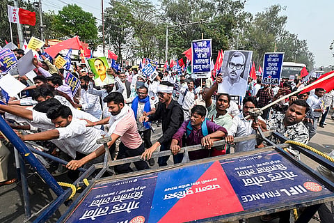 Patna University students scuffle with police barricades during a march to Raj Bhavan in support of the University Grants Commission's newly notified anti-discrimination regulations, organised under the banner of the All India Forum for Equity, in Patna.
