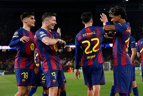 Barcelona's Robert Lewandowski , second left, celebrates with teammates after scoring his side's sixth goal during the Champions League round of 16, second leg soccer match between FC Barcelona and Newcastle United FC in Barcelona, Spain.